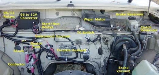 Annotated image of the firewall of an EV truck conversion. Image, annotation and upload by en:User:Leonard G. Transmission removed for replacement, the simple adapter plate has been replaced with a more refined version to ensure accurate alignment. CC SA 1.0